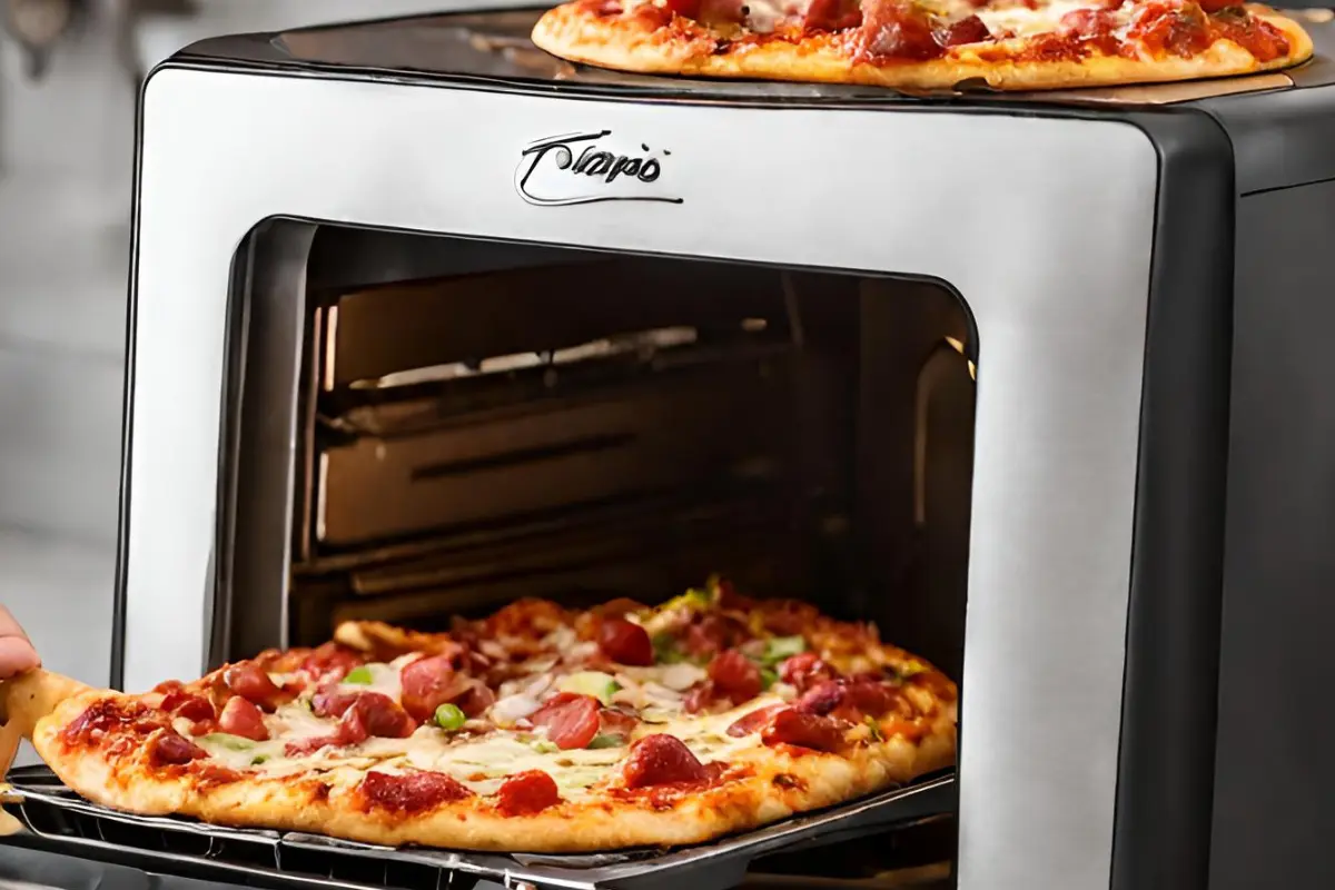 A person taking a pizza out of a Panasonic NN-CS88LBEPG microwave Countertop Grill microwave.